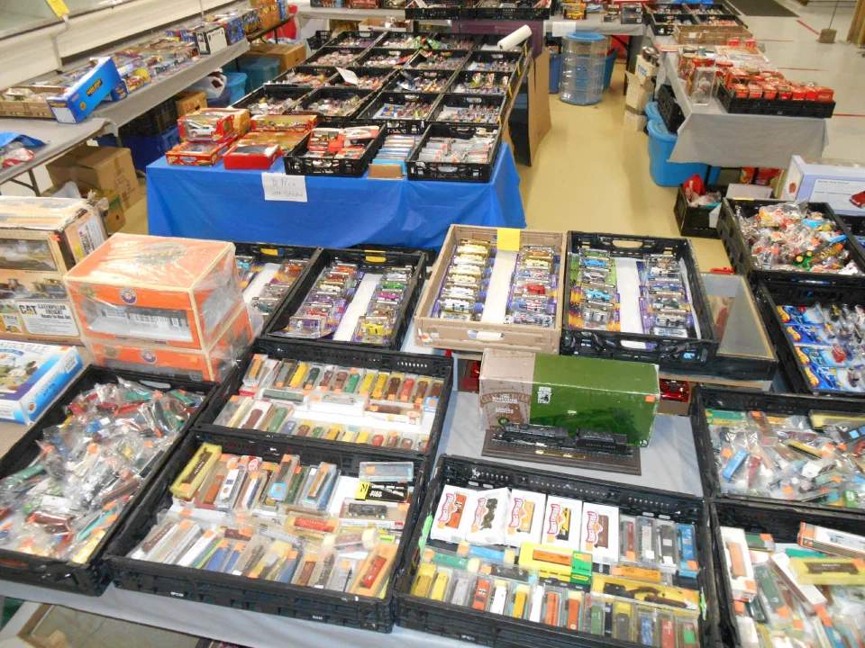 Tables of boxed collectibles laid out at a collectors show